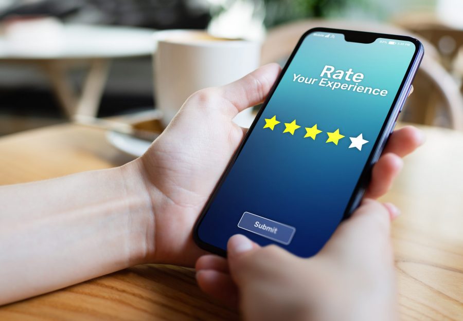 Rate your experience customer satisfaction review Five Stars on mobile phone screen. Business technology concept.